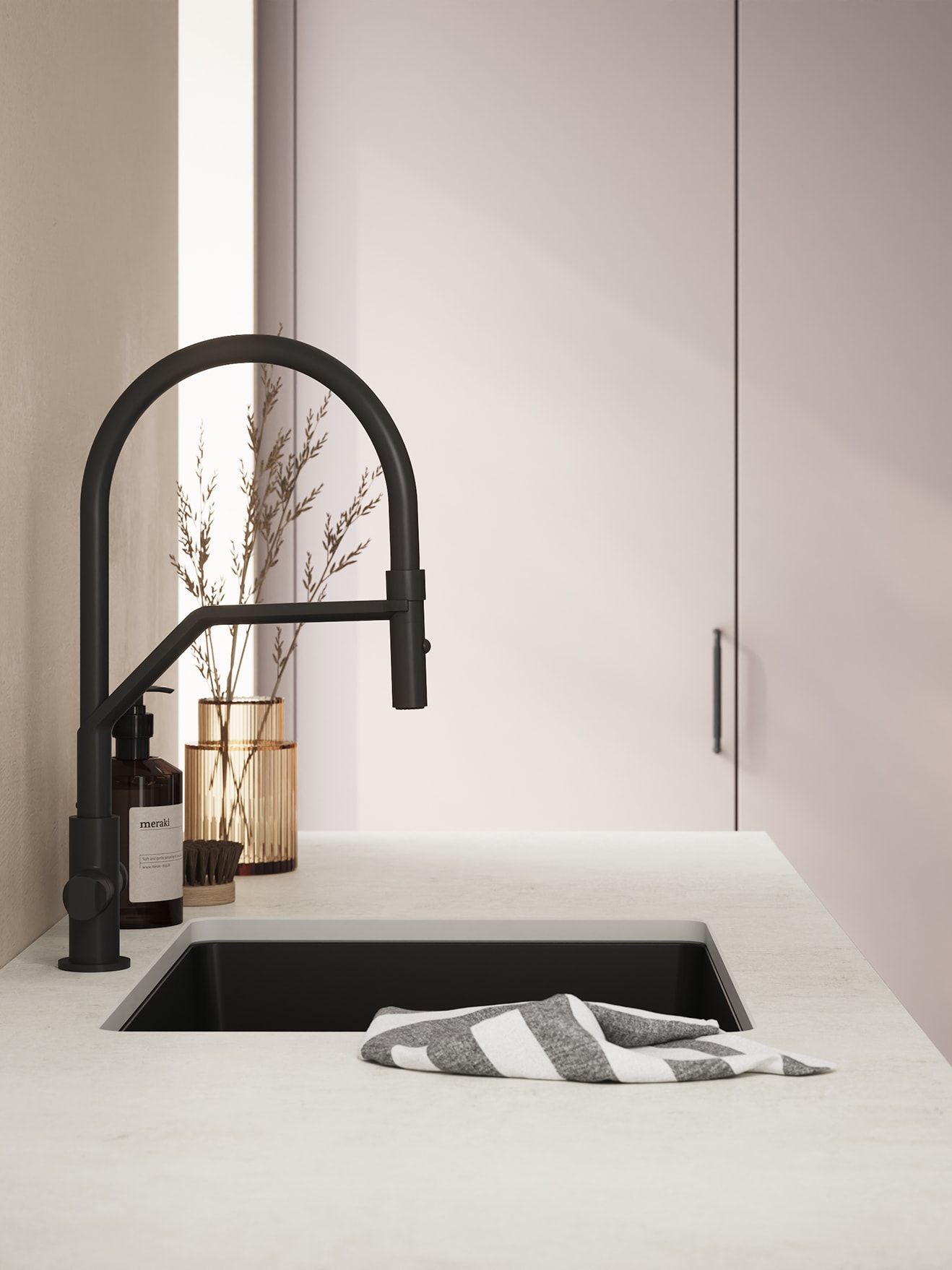 White worktop and black sink in a kitchen