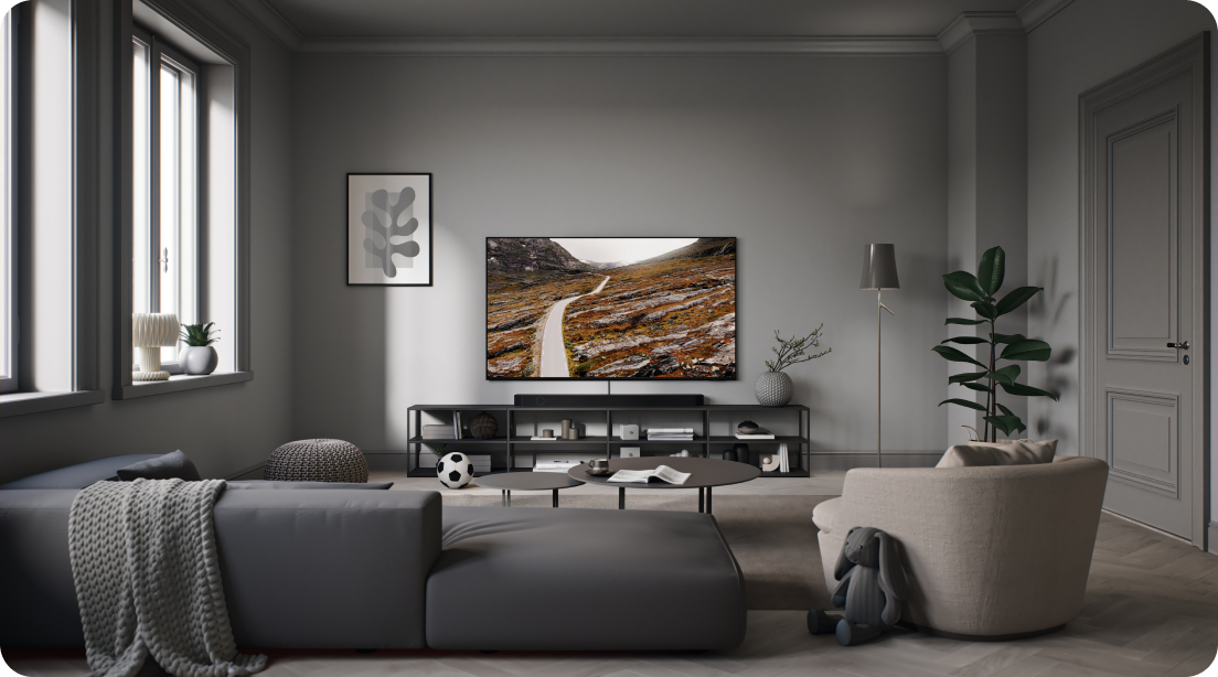 Samsung QLED TV in a dimly lit grey livingroom