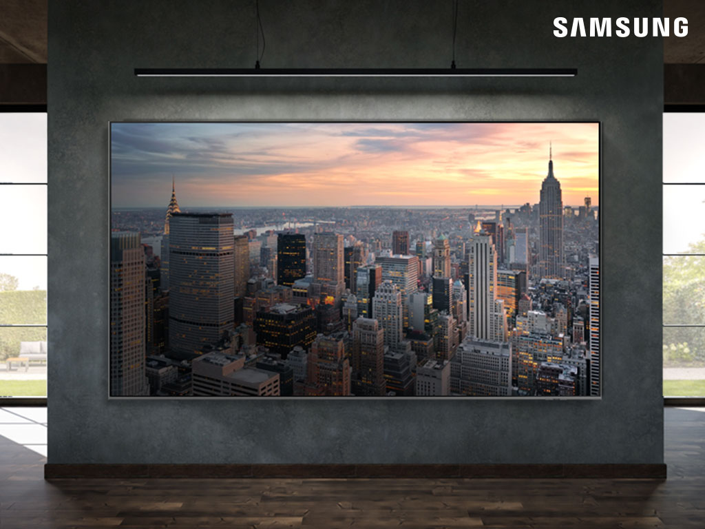 Samsung QLED TV showing a big city aerial image