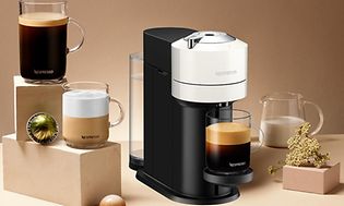 Nespresso coffee machine, coffee drinks, capsules and milk jug