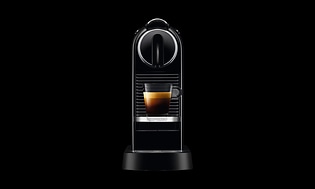 Nespresso Original Coffee Machine on a black background