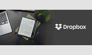 Kobo e-bogslæser på et bord ved siden af en PC og teksten Dropbox