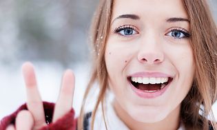 Teenage girl outside in snow